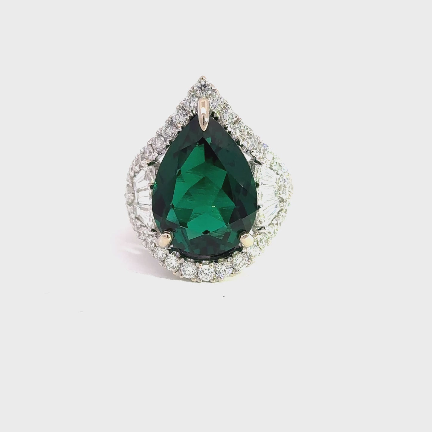 Elegant Pear Shape Emerald and Diamond Ring
